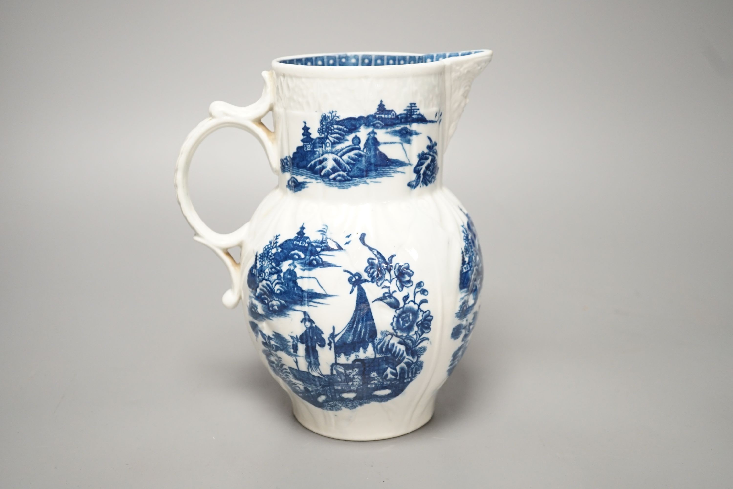 A Caughley mask jug printed with Fisherman pattern, c.1785, S mark, height 19cm